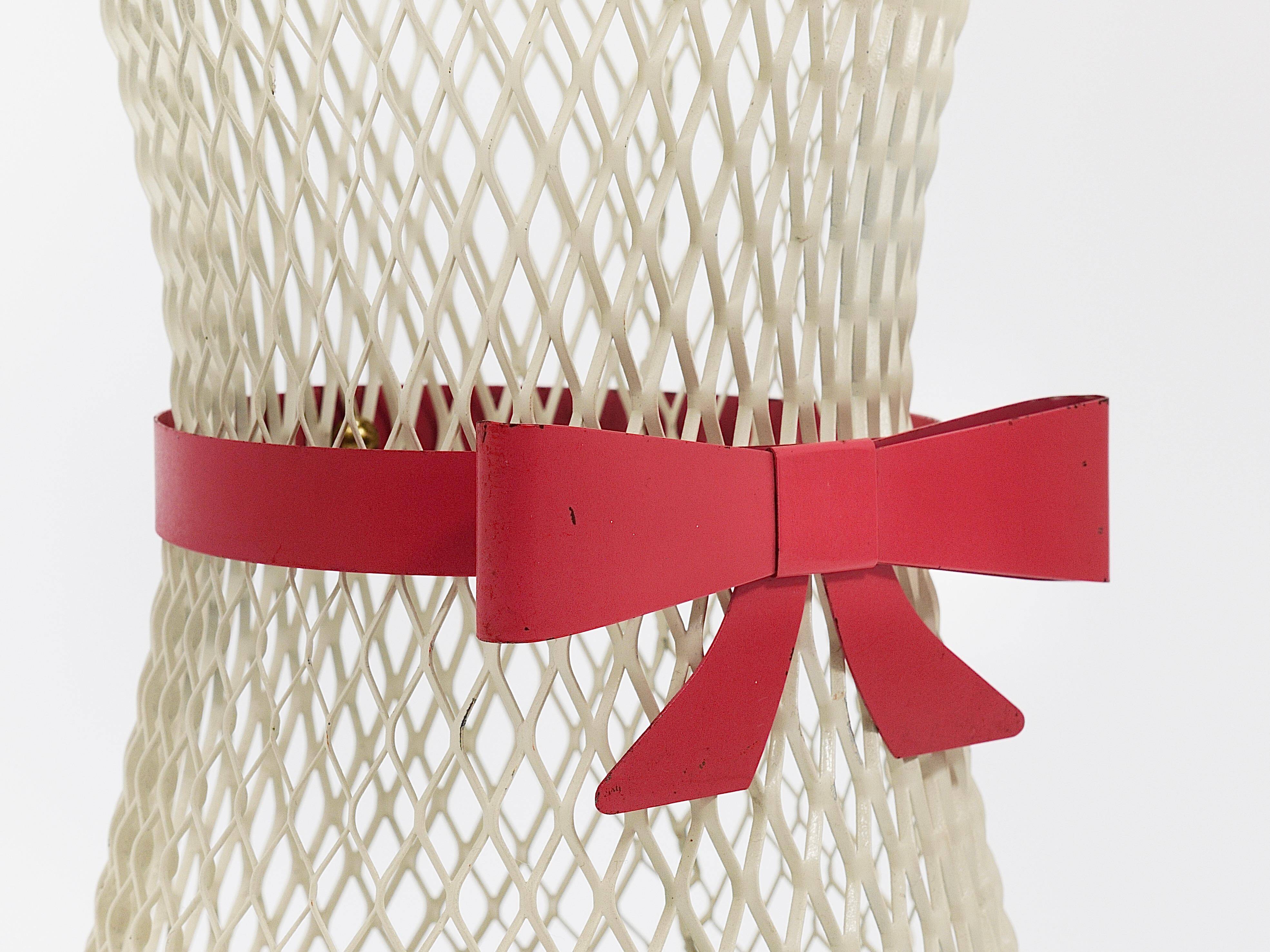 Bow tie umbrella stand in the style of Mathieu Matégot, mid-century, metal, France, 1950s.