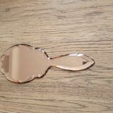 Mirror facing beveled hand
