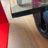 Gae Aulenti coffee table for Fontana Arte, transparent glass top with black cast iron supports, 1980s.