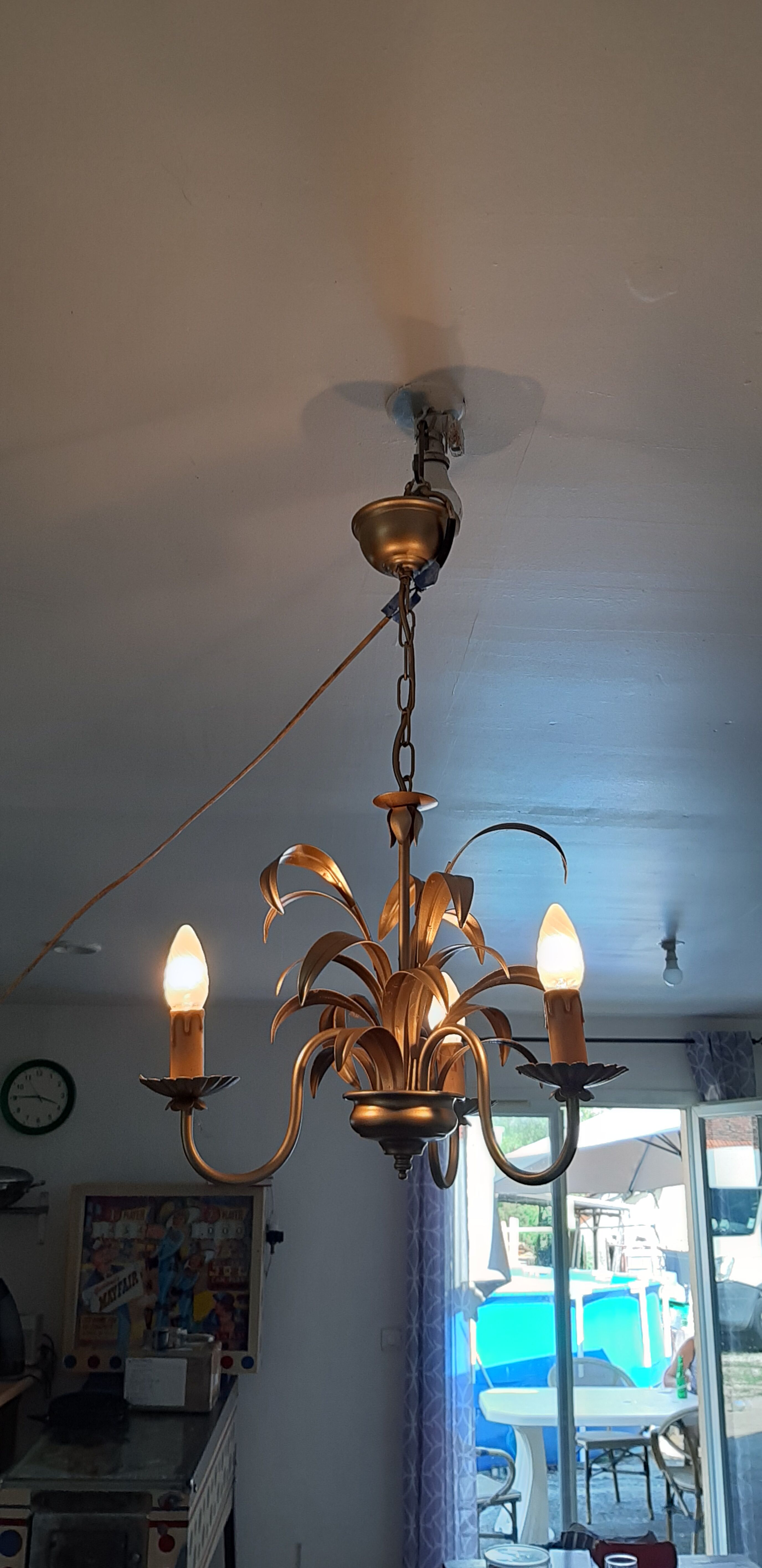 Vintage chandelier in golden metal