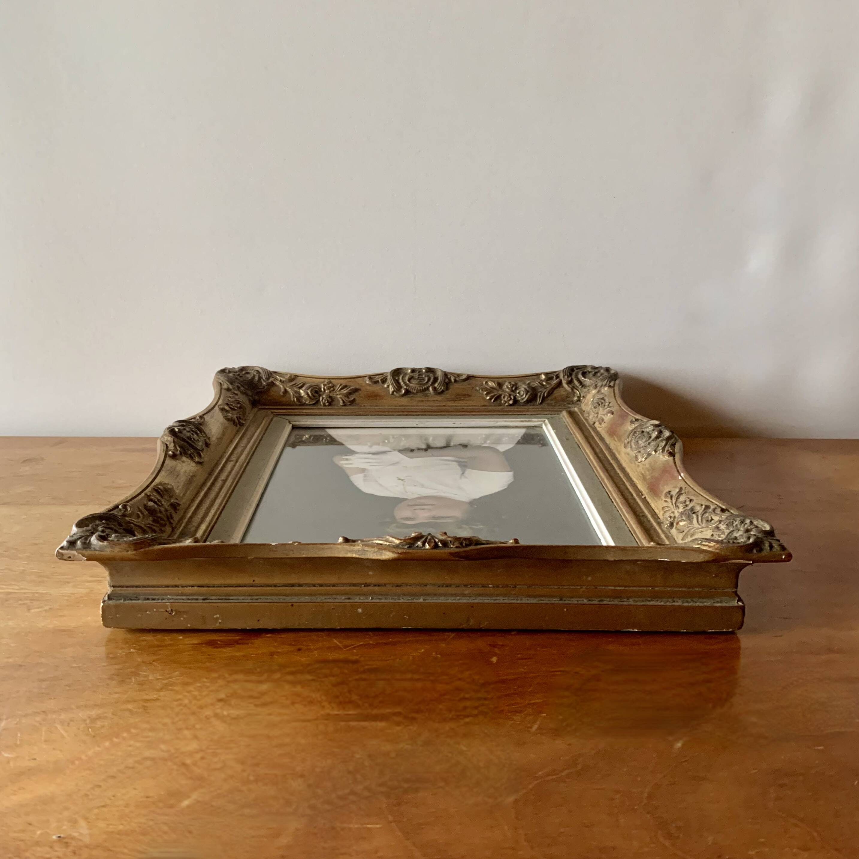 Old gilded carved wooden wall frame