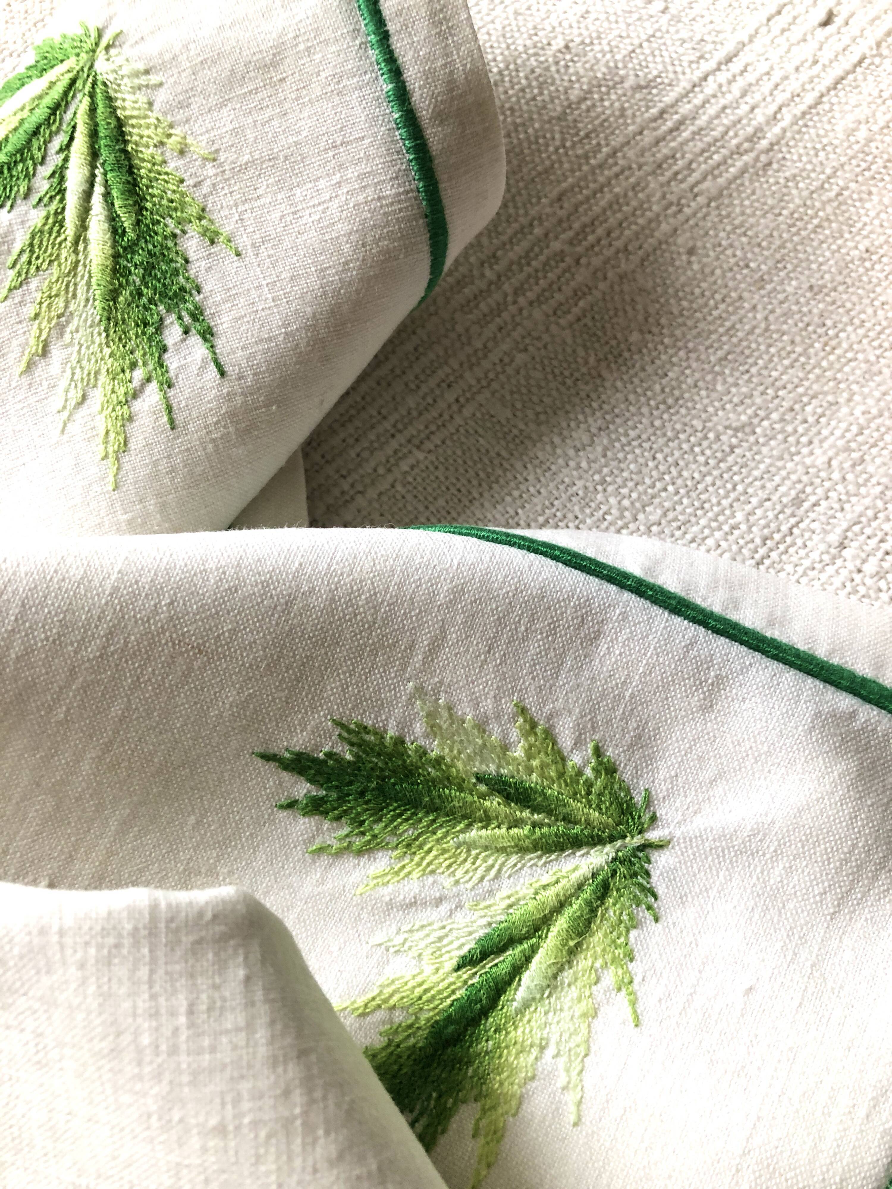 Series of four embroidered linen napkins