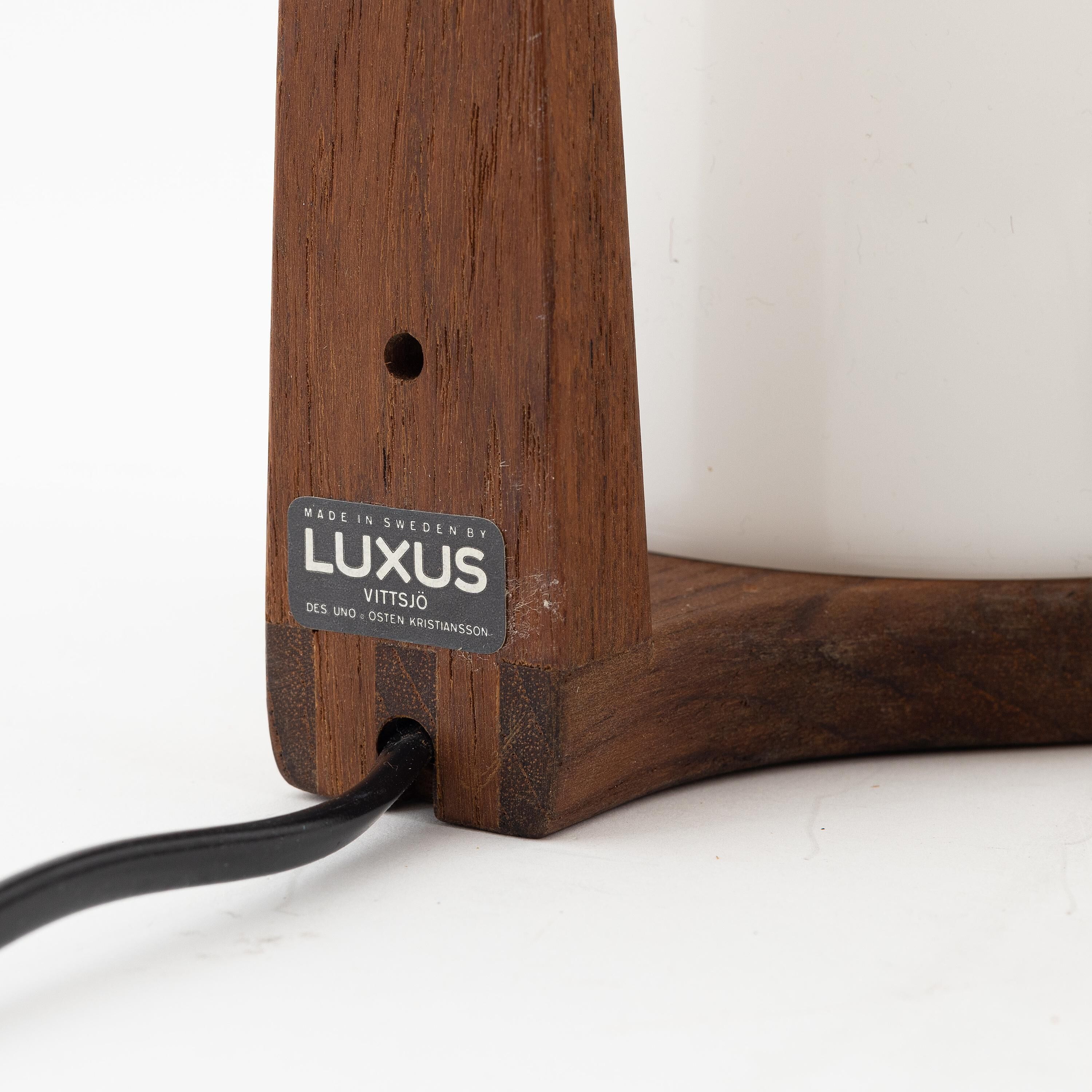 Uno & Östen Kristiansson 2 teak wall lights for Luxus Sweden 1960