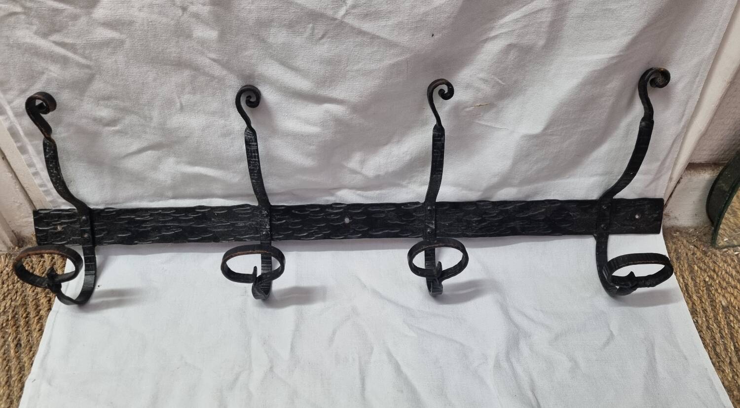 Coat rack with 4 iron coat hooks