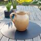 Old pitcher in clear sandstone, signed gres cnp. Village France, early XXeme