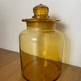 Old apothecary jar in blown amber glass