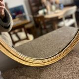 Old golden oval mirror