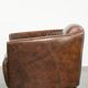 Cowhide armchair in Aviator design in a warm brown colour
