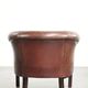 Sheepskin club armchair with patina in a subtle size and a vintage look