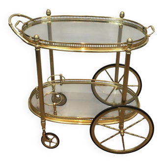 Oval brass rolling table from Maison Baguès