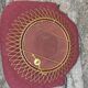 Vintage 1950s sun mirror in gold metal.