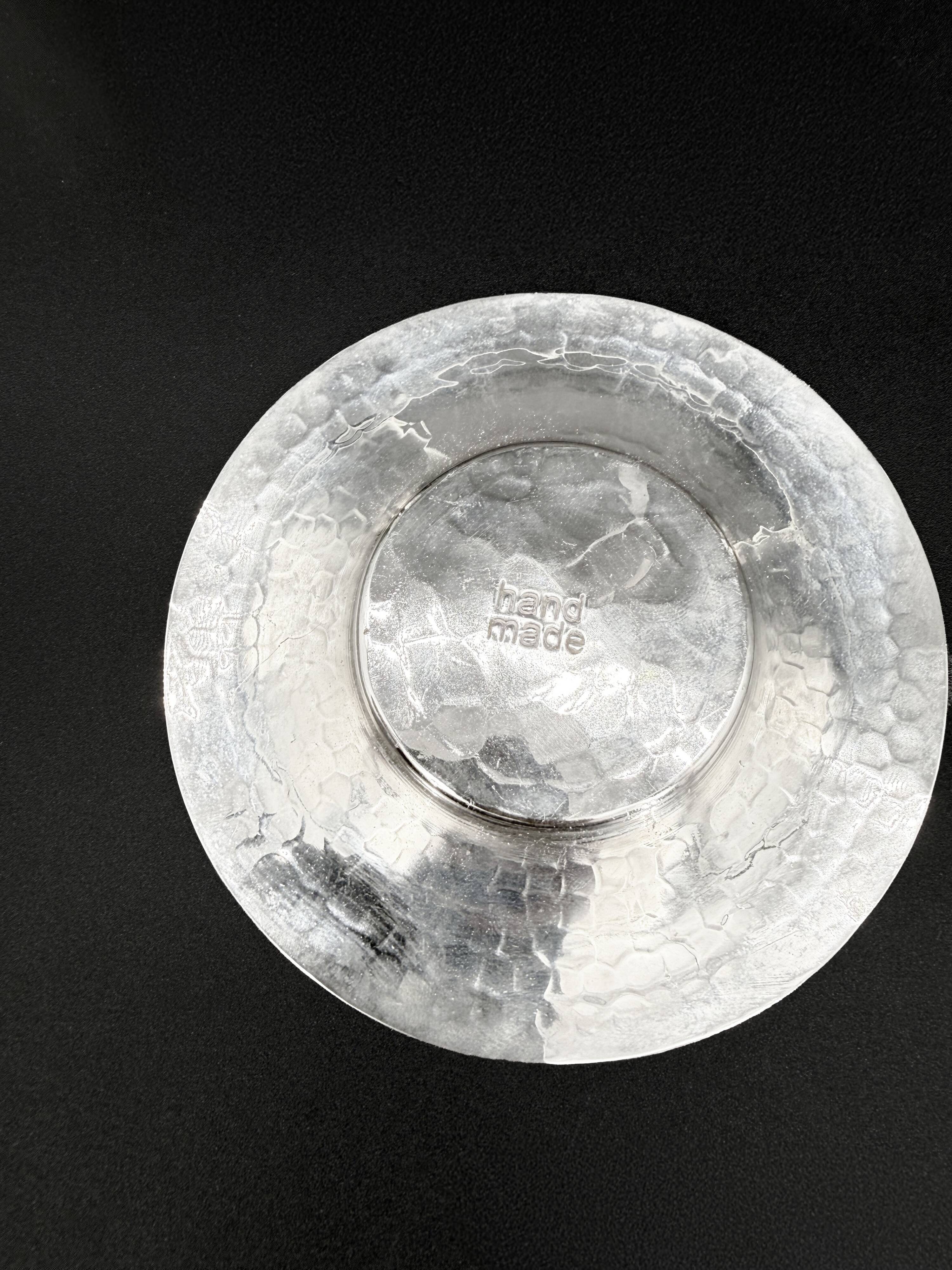 Duo of hammered metal and blown glass cups — handcrafted work