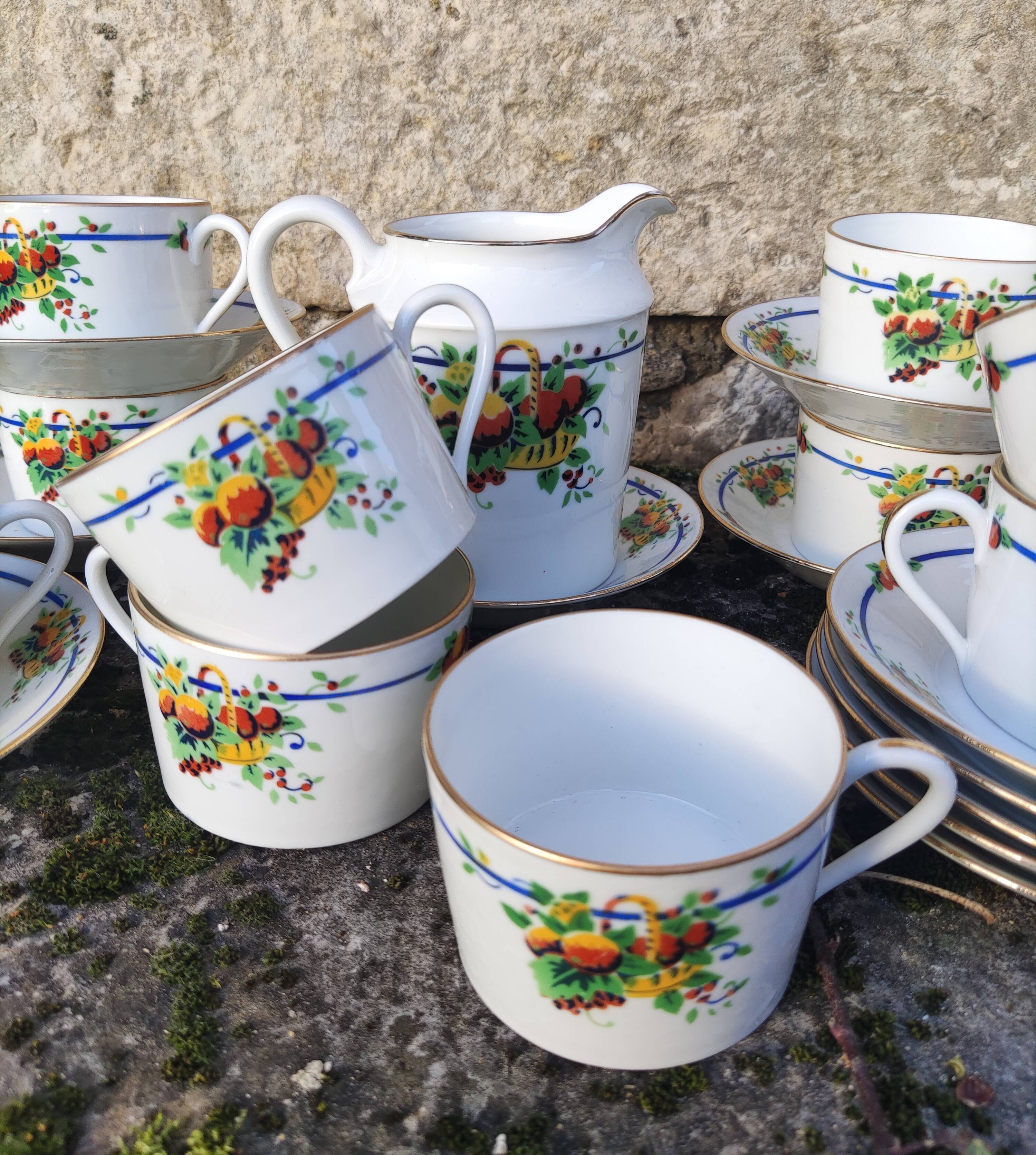 10 tea cups and creamer in Limoges porcelain