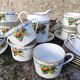 10 tea cups and creamer in Limoges porcelain