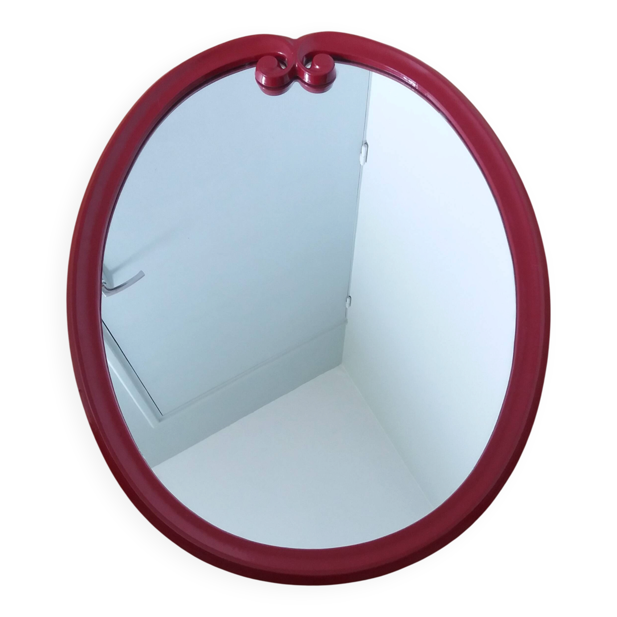 Oval mirror, red enamelled metal in Art Deco style, 49 x 39 cm.