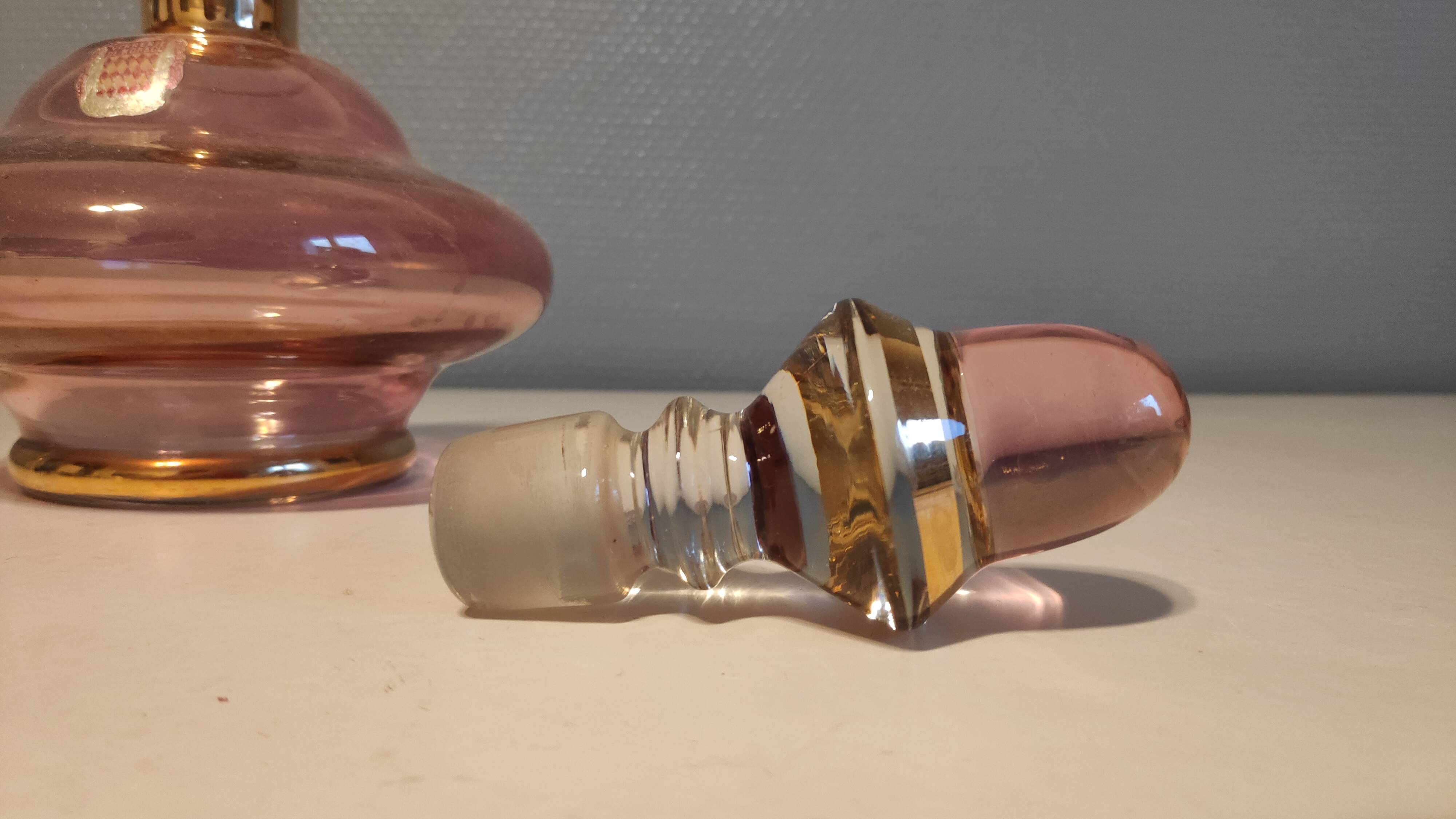 Pink and gold glass carafe stamped "Monaco glassware"