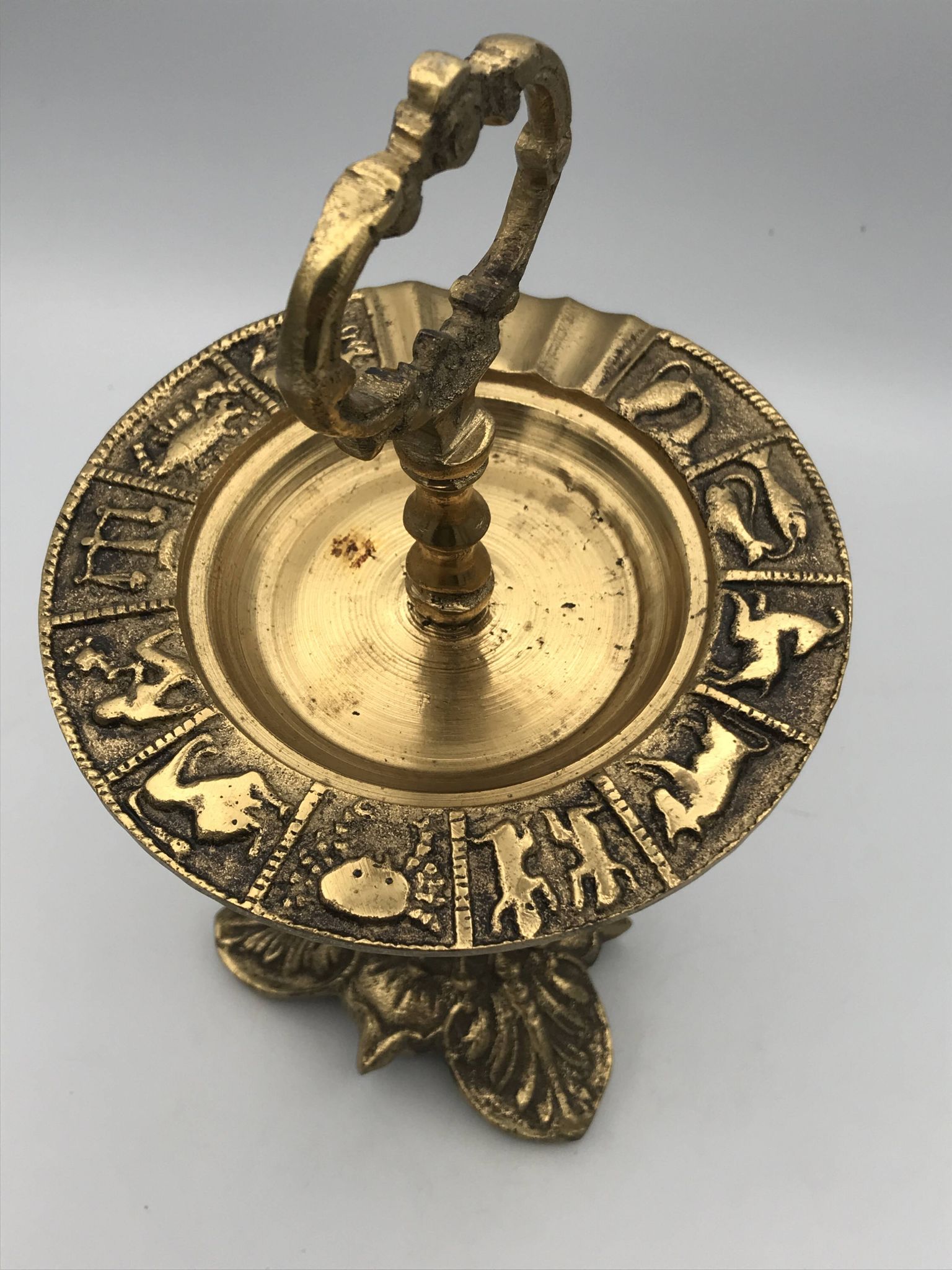 Vintage solid brass ashtray with zodiac sign decor