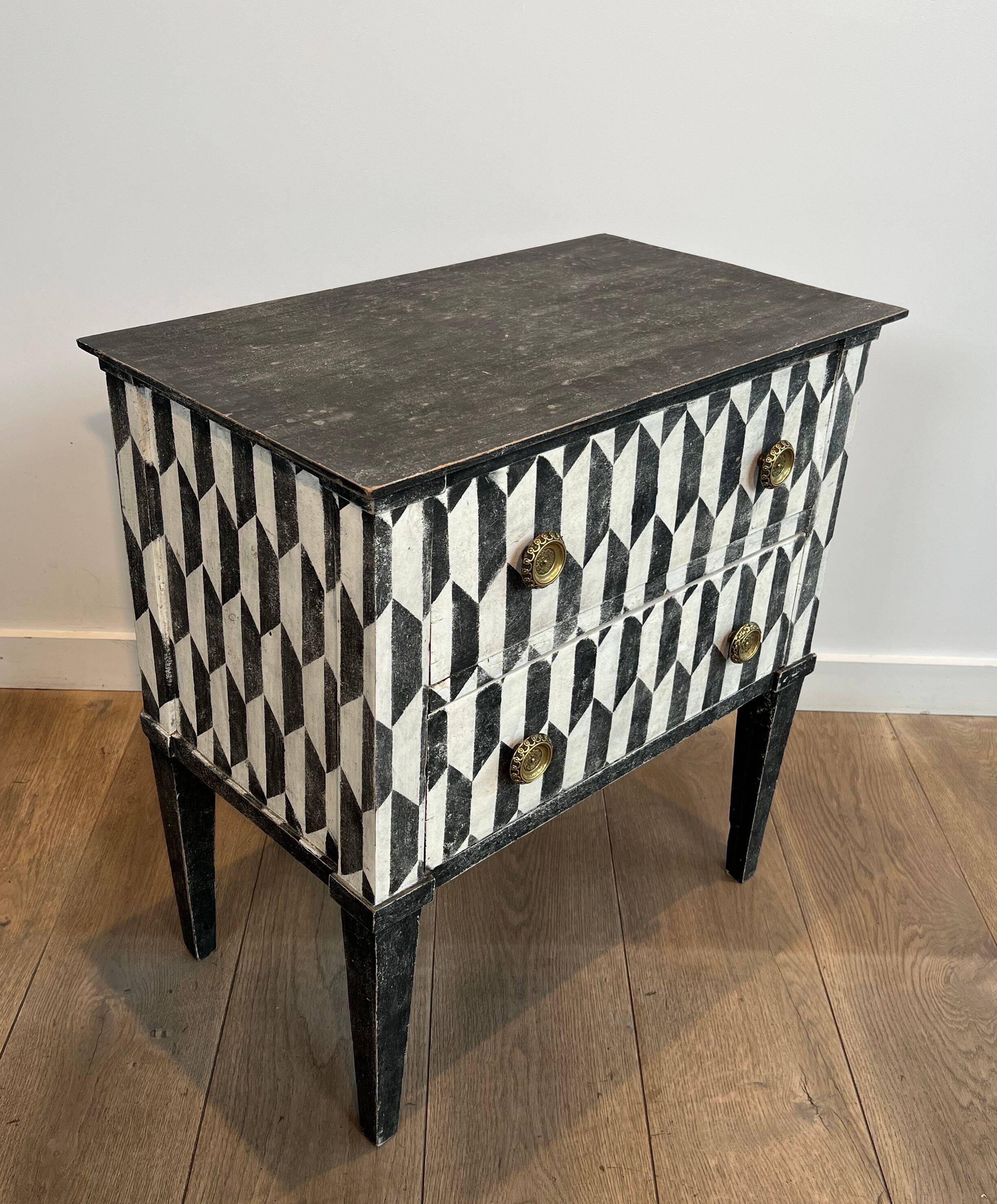 Small Italian chest of drawers with two drawers, patinated with a trompe-l'œil checkerboard pattern