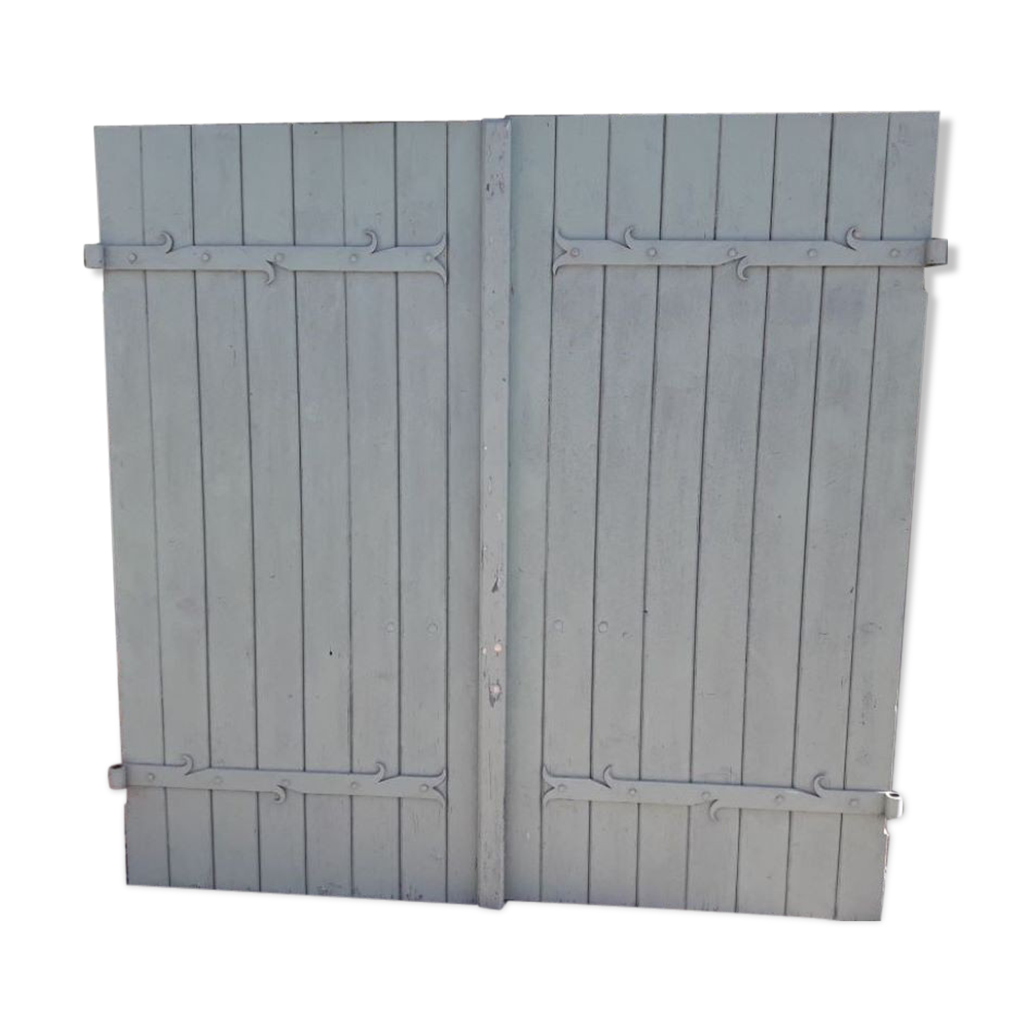 Pair of wooden shutters hanging iron