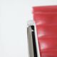 "EA 108" armchair in red leather, designed by Charles and Ray Eames for Vitra,