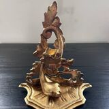 Golden console in rococo style