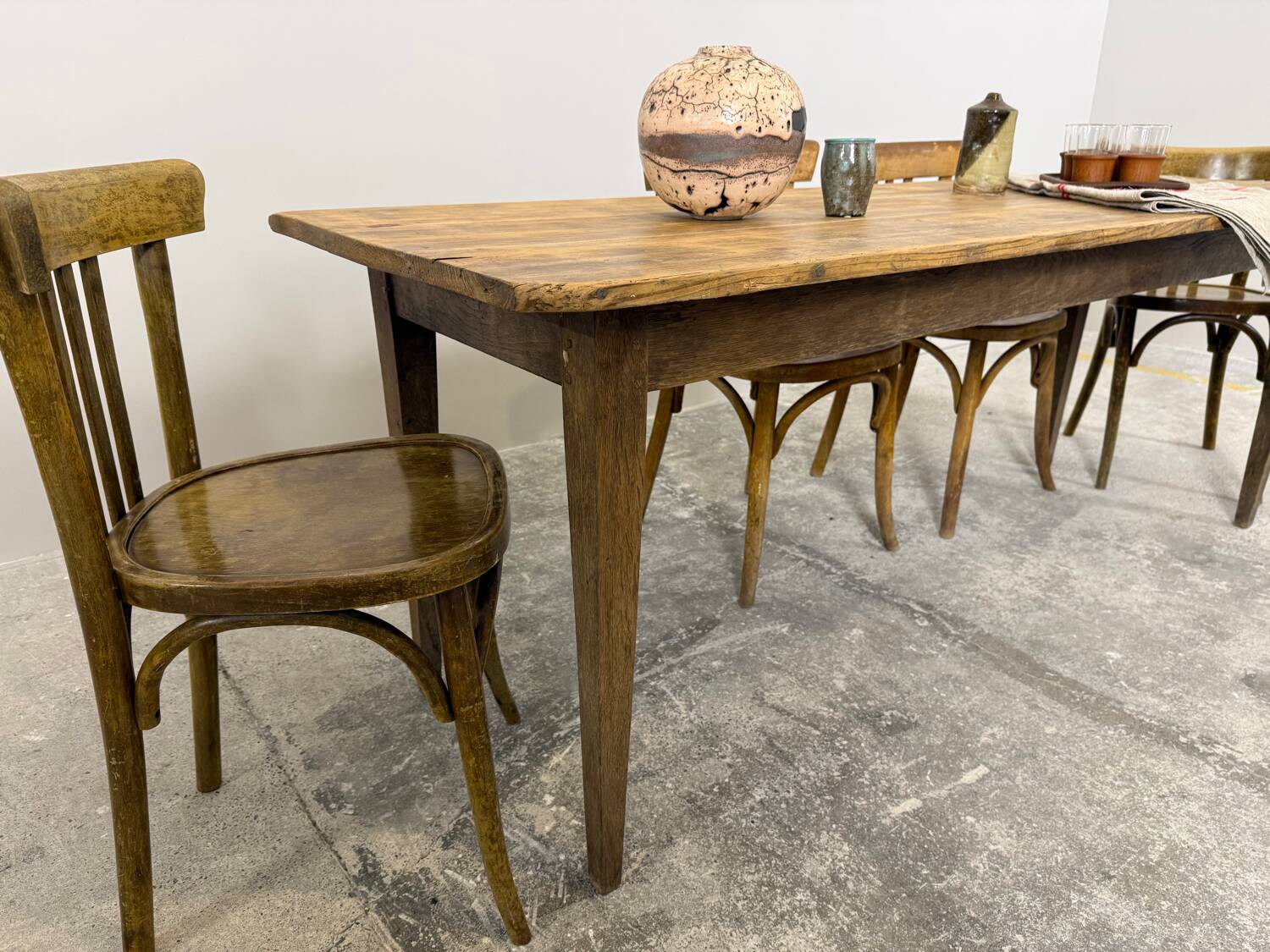 Old farmhouse table with tapered legs, late 19th to early 20th century.