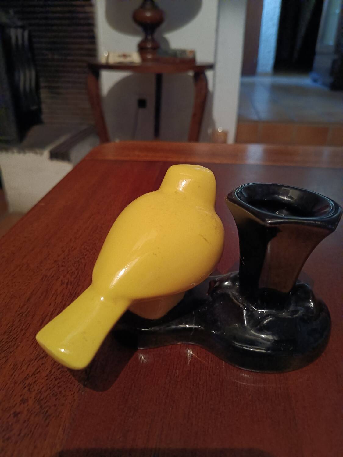 Yellow canary figurine and its candle holder