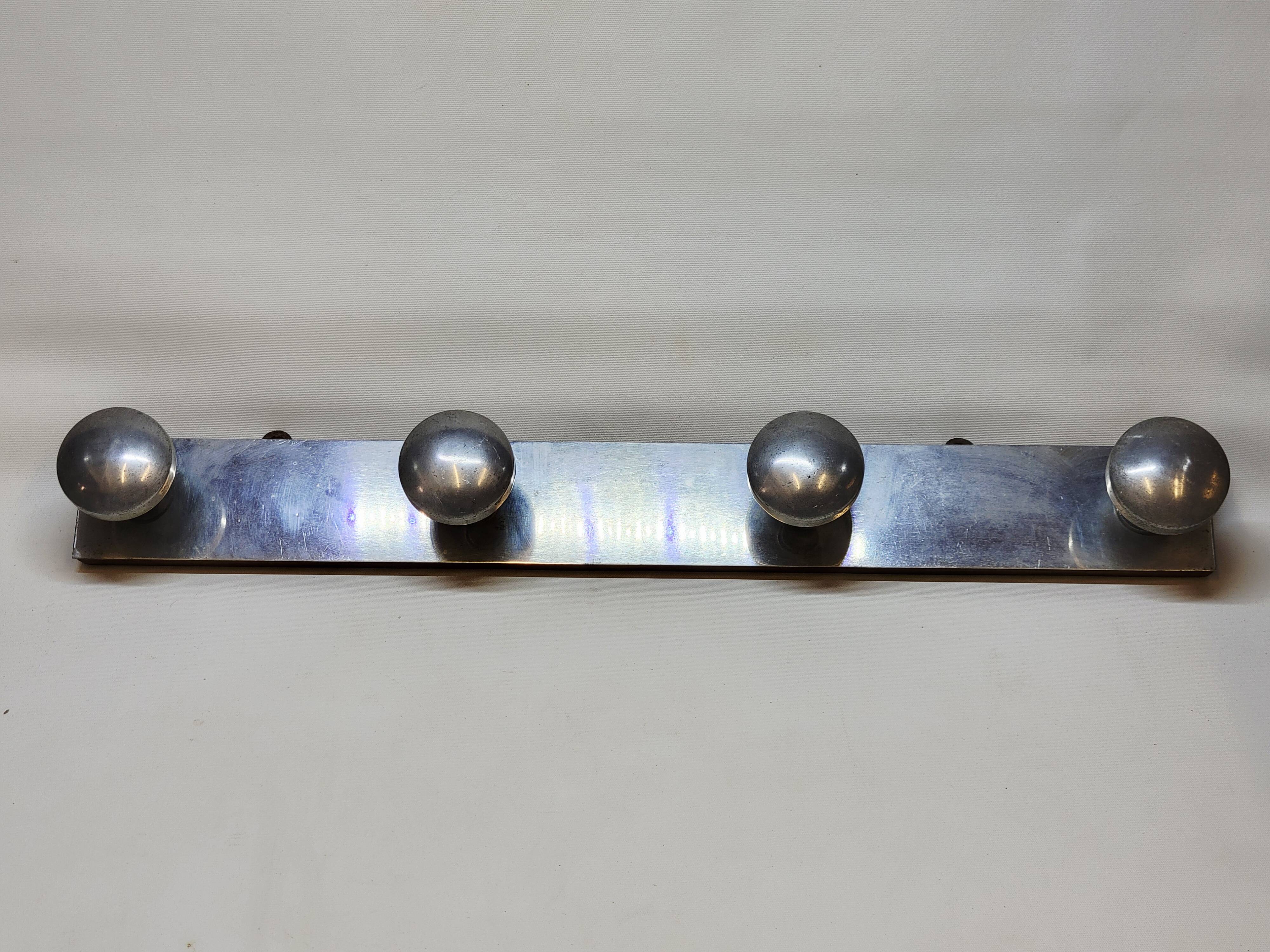 Retro vintage coat rack with 4 aluminum hooks on a wooden frame