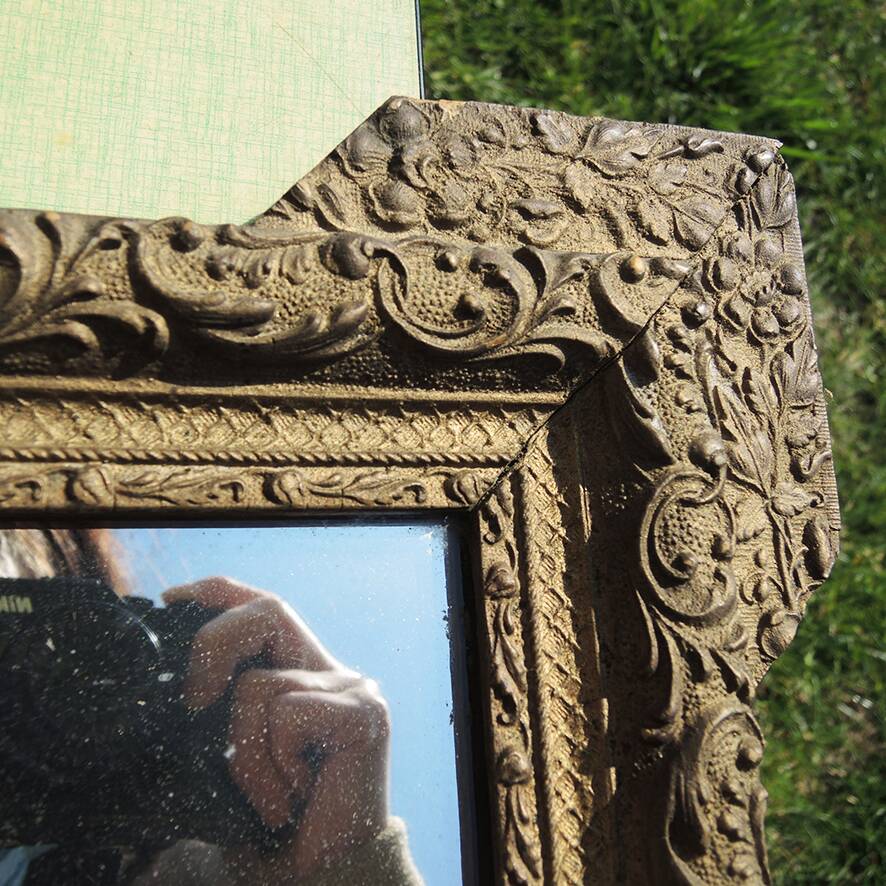 Old wooden and gilded stucco mirror