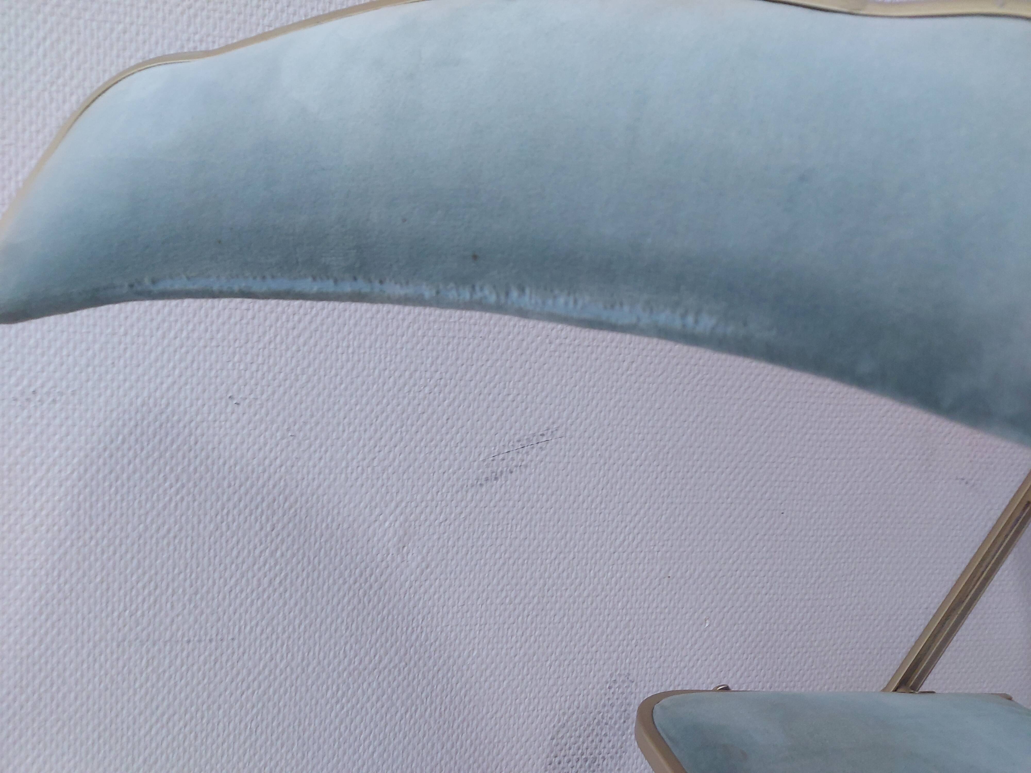 Two folding opera chairs in velvet