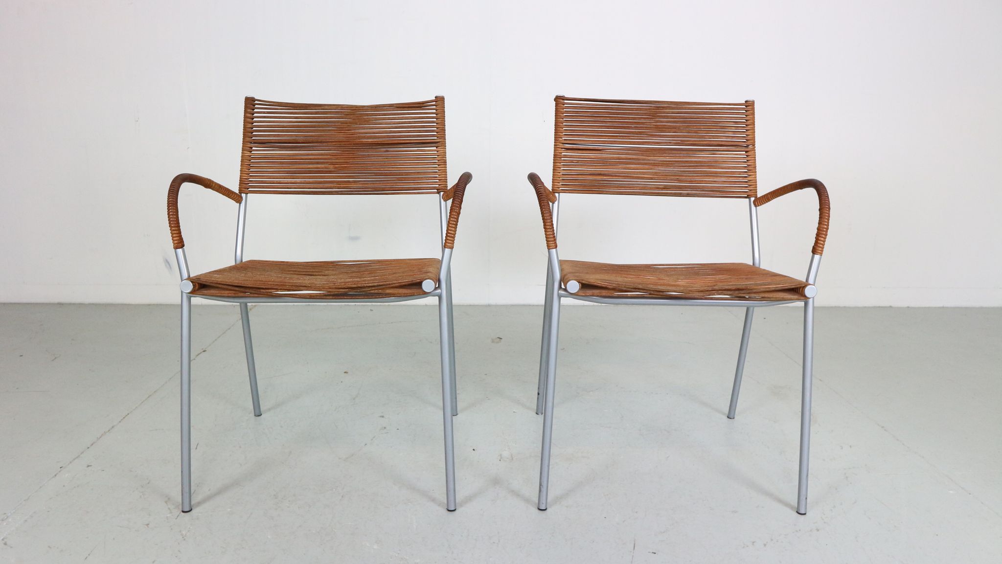 Set of 2 leather Mis B2 RVS armchairs by Tito Agnoli  for Pierantonio Bonacina