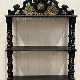 Blackened wooden shelf.