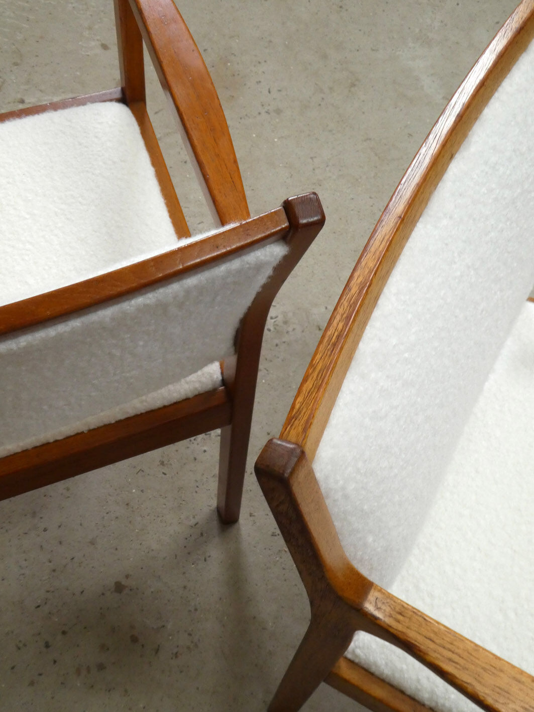 pair of Scandinavian teak armchairs and white buckles