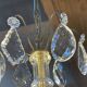 Three-light chandelier in bronze and cut crystal, early 20th century work.
