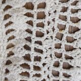 White two-seater crocheted bed top