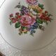 4 mismatched flat plates with floral patterns. Porcelain. Stamped
