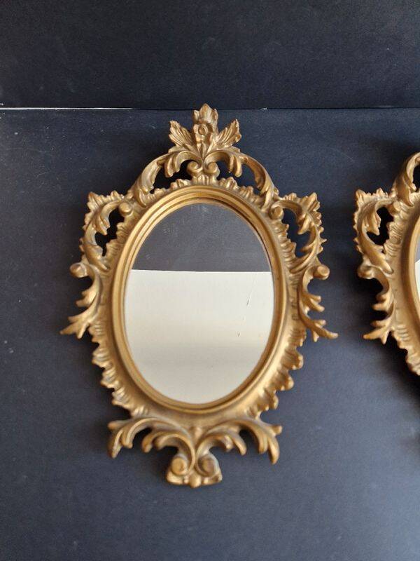 Pair of gilded rococo style mirrors, 1970s