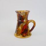 Beautiful ceramic pitcher in fire colors
