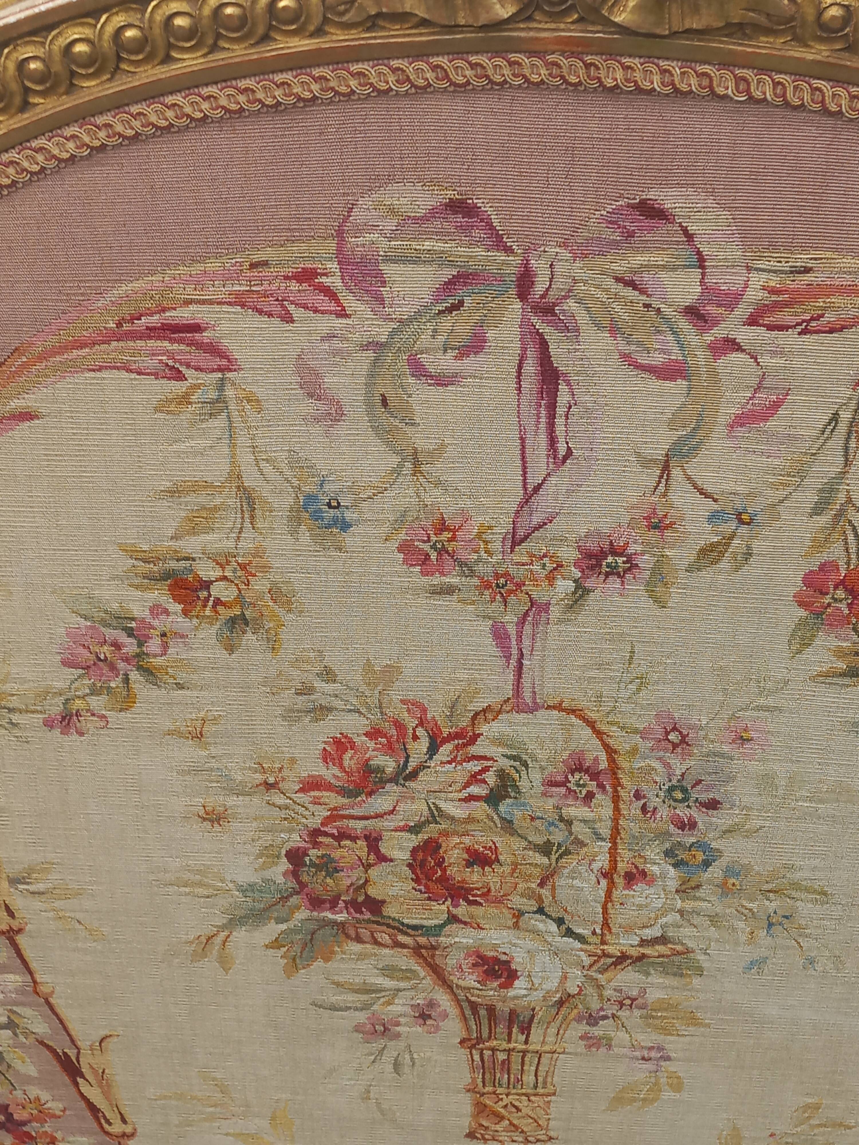 Golden wooden fireplace screen and Aubusson tapestry, 19th century.