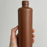 Decorative brown ceramic bottle.