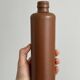 Decorative brown ceramic bottle.