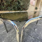 Vintage curved rectangular dining table in smoked glass and metal.