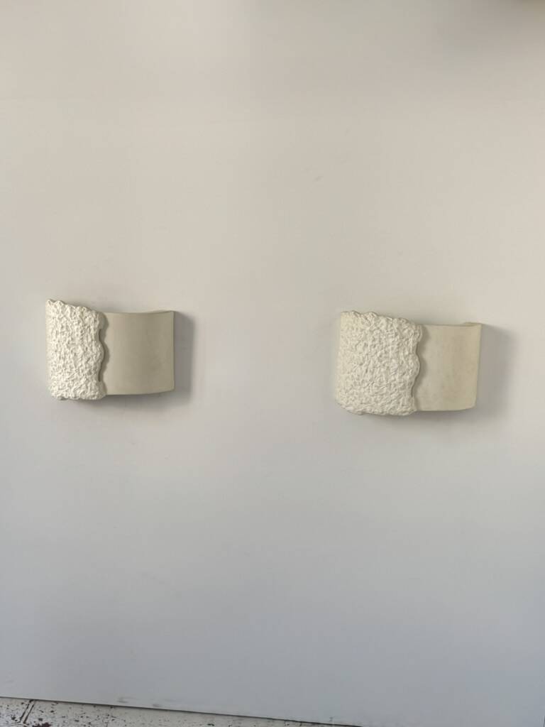Pair of vintage wall lights in smooth plaster and stone imitation, France, 1970.