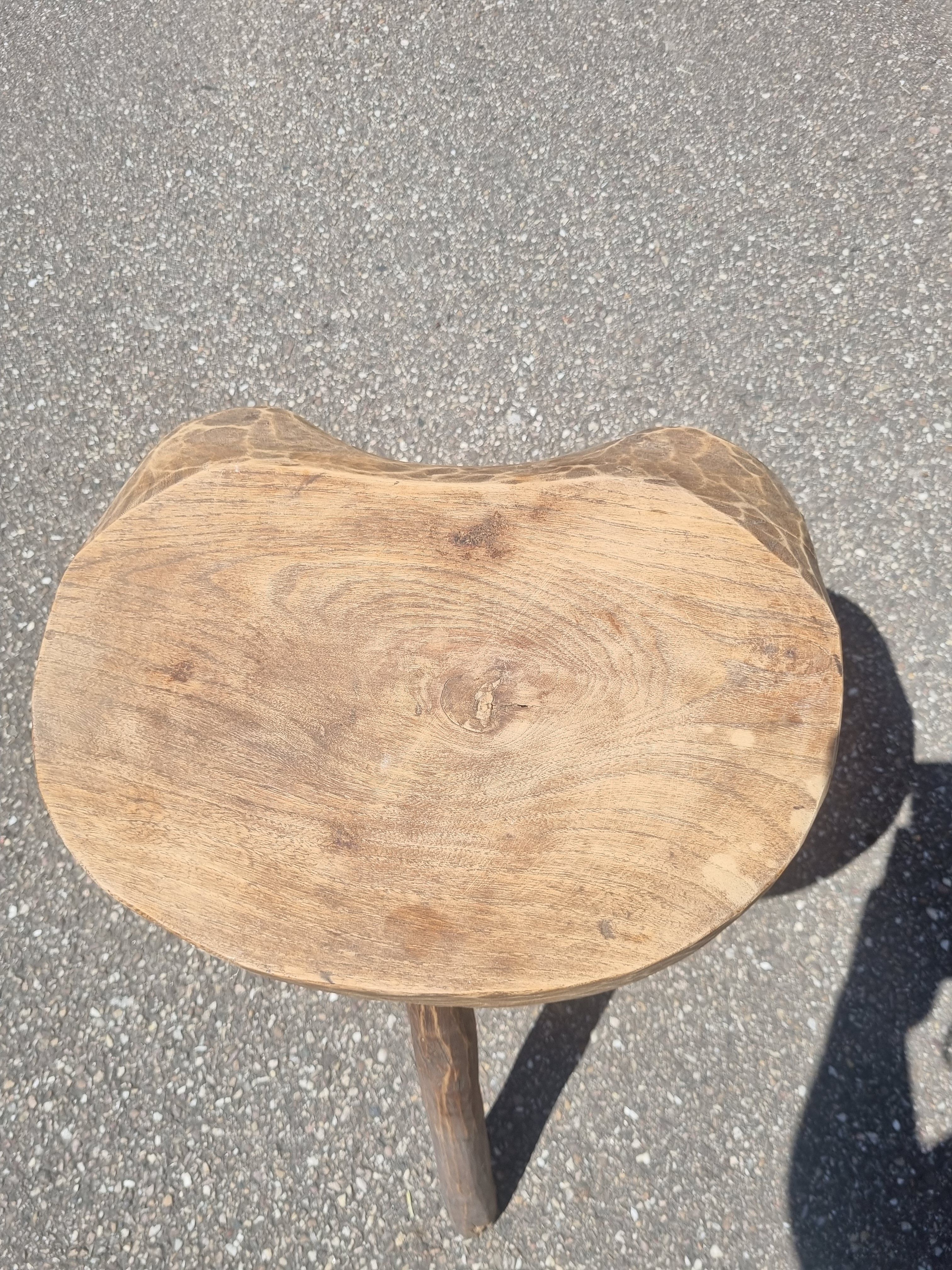Old wooden tripod stool
