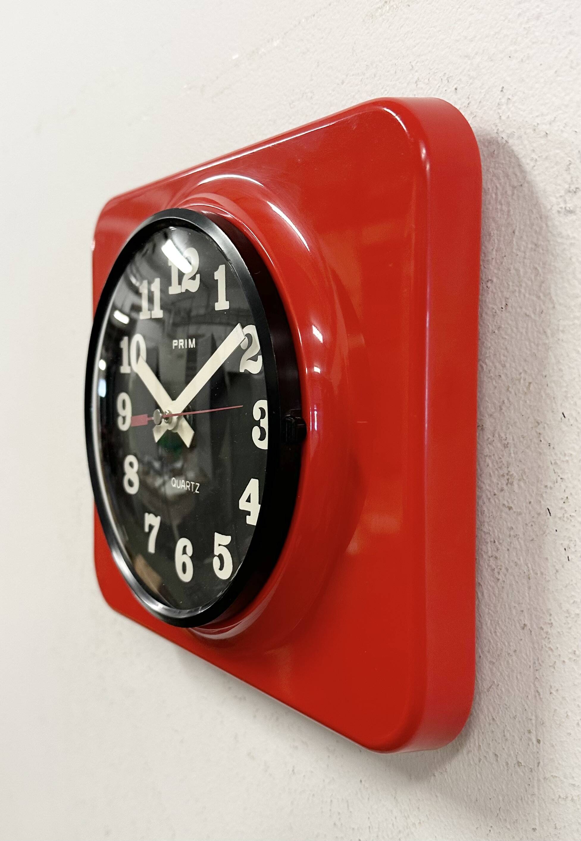 Vintage red bakelite wall clock from prim, 1970s