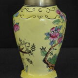 Old yellow ceramic vase decorated with flowers and a pheasant