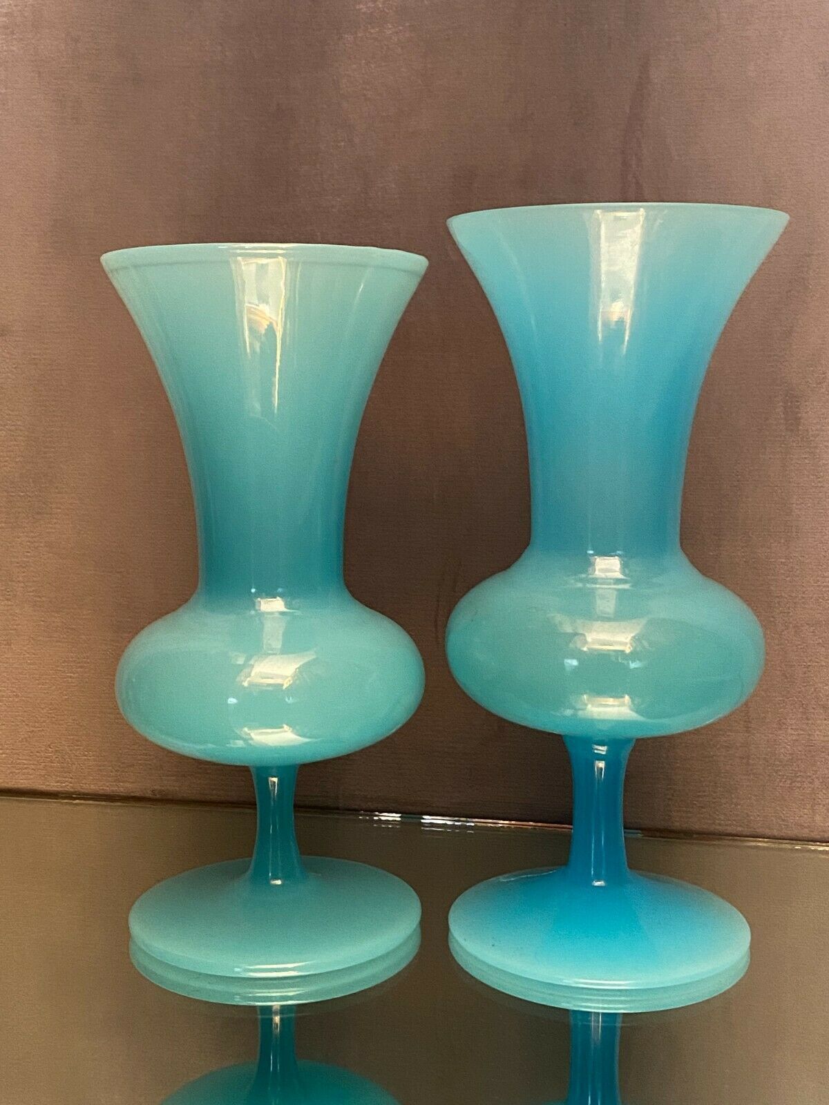 Two vases on a pedestal in blue opaline