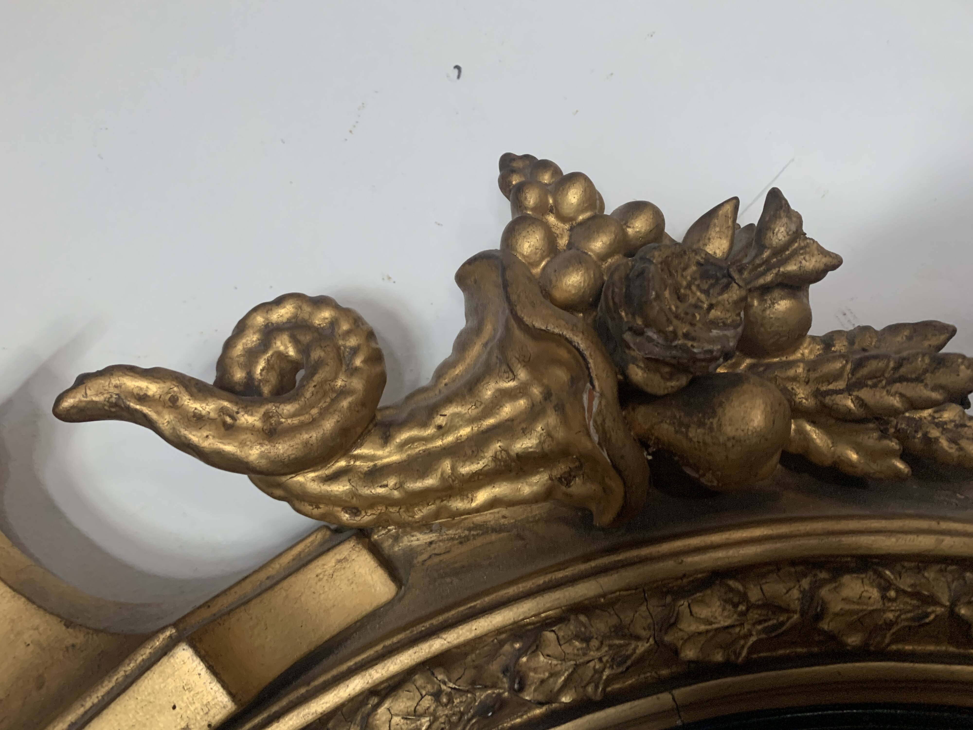 Miroir sorcière en bois sculpté doré XIX siècle
