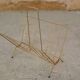 Magazine rack in gilded metal, early 1970s