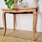 Antique coffee table with curved legs.